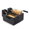 A black double deep fryer with two frying baskets, one filled with french fries and the other with chicken nuggets. The fryer has two control knobs. Náhľad obrázku produktu