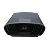 A black projector is shown from a front-facing, slightly angled perspective against a white background. Produktbild-Vorschau