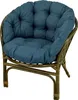 A close-up studio shot of a rattan chair with a blue cushion. Produktbild-Vorschau