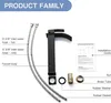 A flat lay of a black waterfall faucet and its components, with labels pointing to each part and an installation guide. Produktbild-Vorschau