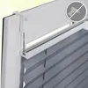 A close-up view of a window blind mechanism and the top part of the blind. Produktbild-Vorschau
