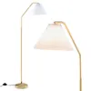 A floor lamp with a gold stand and a white pleated shade is shown against a white background. Podgląd zdjęcia produktu