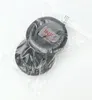 A product shot of black ear pads inside a clear plastic bag, with a label on top. Náhled obrázku produktu