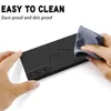 A hand is cleaning the back of a black smartphone case with a cloth. Text overlays describe the product's features. Náhľad obrázku produktu