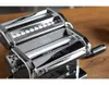 A close-up view of a shiny, chrome-plated pasta maker on a wooden surface. Náhled obrázku produktu