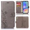 A collage of images showing a grey flip phone case with a floral and butterfly design, a phone inside the case, and the back of the case. Produktbild-Vorschau