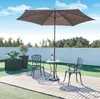 An outdoor patio set with a table, two chairs, and an umbrella, set on a wooden deck with artificial grass surrounding it. Anteprima dell’immagine prodotto