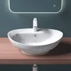 A white ceramic sink with a modern faucet sits on a wooden countertop against a teal wall. Produktbild-Vorschau