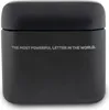 A black TWS headphones docking station with text on the front. Anteprima dell’immagine prodotto