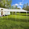 A white party tent is set up in a grassy field next to a camper van. Náhled obrázku produktu
