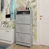 A hallway with a shoe cabinet, bench, and coats hanging on the wall. Náhľad obrázku produktu