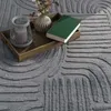 A close-up view of a rug with decorative items on a wooden tray. Anteprima dell’immagine prodotto