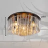 A close-up view of a ceiling light fixture with glass rods and exposed bulbs. Produktbild-Vorschau