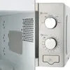 Close-up view of the control panel and interior of a microwave oven. Produktbild-Vorschau