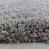 A close-up of a beige shaggy rug. Produktbild-Vorschau