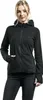 A woman wearing a black zip-up hoodie and black jeans, posing against a white background. Anteprima dell’immagine prodotto