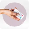 A hand holding a white remote control with various buttons. Anteprima dell’immagine prodotto