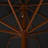 Close-up view of the internal structure of an open umbrella, showing the wooden ribs and central pole. Produktbild-Vorschau
