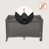 A close-up view of a travel crib with an inset showing how to assemble a part of it. Voir les images du produit