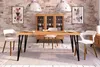 A dining room scene with a wooden table and chairs, a cabinet, and artwork on the wall. Produktbild-Vorschau