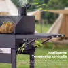 A close-up view of a black charcoal grill with a chicken cooking inside, set outdoors with tents in the background. Green arrows indicate airflow. Anteprima dell’immagine prodotto
