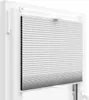 A white pleated blind is installed in a white window frame. Produktbild-Vorschau