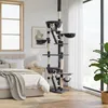 A cat tree is set up in a bedroom next to a bed and a window. Produktbild-Vorschau