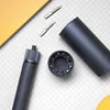 A flat lay of a cordless precision screwdriver set with its accessories on a grid background. Voir les images du produit