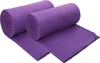 Two rolled-up purple fleece blankets are shown on a white background. Produktbild-Vorschau