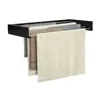 A black wall-mounted towel rack with several towels hanging on it. Náhľad obrázku produktu