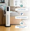 A white humidifier is placed on a wooden floor next to a brown leather sofa. Text overlays describe its features. Anteprima dell’immagine prodotto