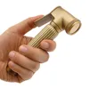 A hand holding a handheld bidet sprayer. Podgląd zdjęcia produktu