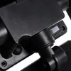 A close-up view of a black solar lamp, focusing on its adjustable joints and a small grey switch. Náhled obrázku produktu
