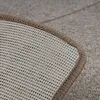 A close-up view of the corner of a rug, showing the backing and the edge binding. Náhled obrázku produktu