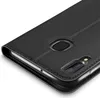 A close-up, angled view of a black flip case for a smartphone, showing the camera cutout and fingerprint sensor area. Produktbild-Vorschau