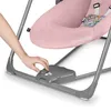 A close-up of a person's hand adjusting a control panel on a pink baby swing. Produktbild-Vorschau