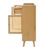 A side view of a wooden cabinet with a rattan door and an open drawer. Voir les images du produit