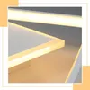A close-up view of a modern LED ceiling light fixture with a white finish and integrated lighting. Voir les images du produit