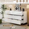 A white sideboard with open drawers in a living room setting. Produktbild-Vorschau