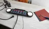 A power strip with multiple outlets and switches is placed on a wooden table, along with some tools and sandpaper. Produktbild-Vorschau