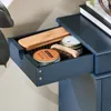 A close-up view of an open drawer containing shoe care items. Náhľad obrázku produktu