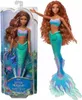 A doll in packaging and a separate doll. Voir les images du produit