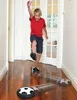 A young boy playing with a hover soccer ball indoors. Produktbild-Vorschau