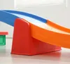 A close-up shot of a colorful children's slide. Voir les images du produit