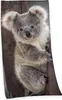 A close-up of a koala clinging to a tree trunk. Produktbild-Vorschau