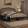 A black metal bed frame in a bedroom setting. Produktbild-Vorschau