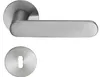 A modern, brushed stainless steel door handle set with a flat rosette and a matching keyhole escutcheon, presented against a plain white background. Produktbild-Vorschau