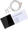 A digital thermostat, its manual, and accessories are laid out on a white background. Podgląd zdjęcia produktu