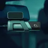 A dashcam mounted on a car's windshield, with a rearview mirror visible. Náhľad obrázku produktu