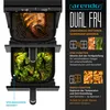 An air fryer with two separate cooking chambers, one showing cooked fish and the other showing cooked broccoli. Text overlays describe features. Produktbild-Vorschau